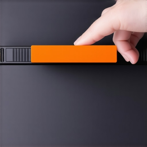 Close-up of a finger sliding a physical webcam cover closed on a laptop bezel.